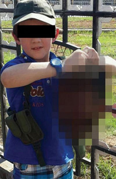 childholdsheadsevered.jpg